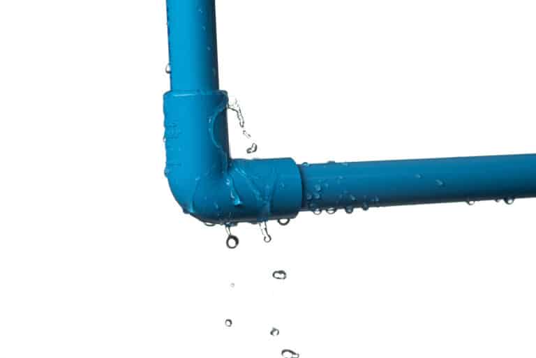 Leaked and splash water from pvc plastic pipe isolated on white background, Whole-Home Repiping.