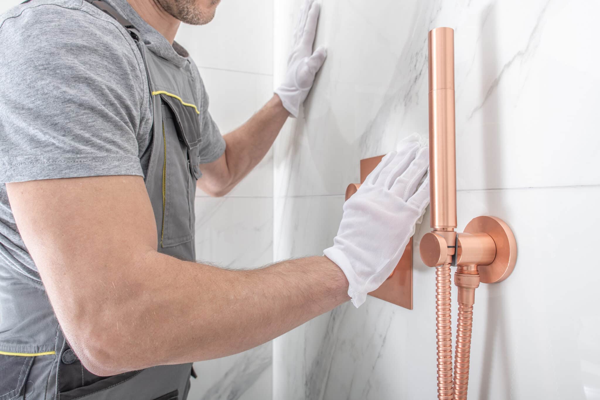 Installing low-flow fixtures, shower head, Whole Home Plumbing Solutions.