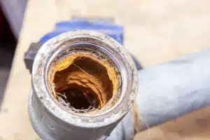 How hard water creates scale inside pipes.