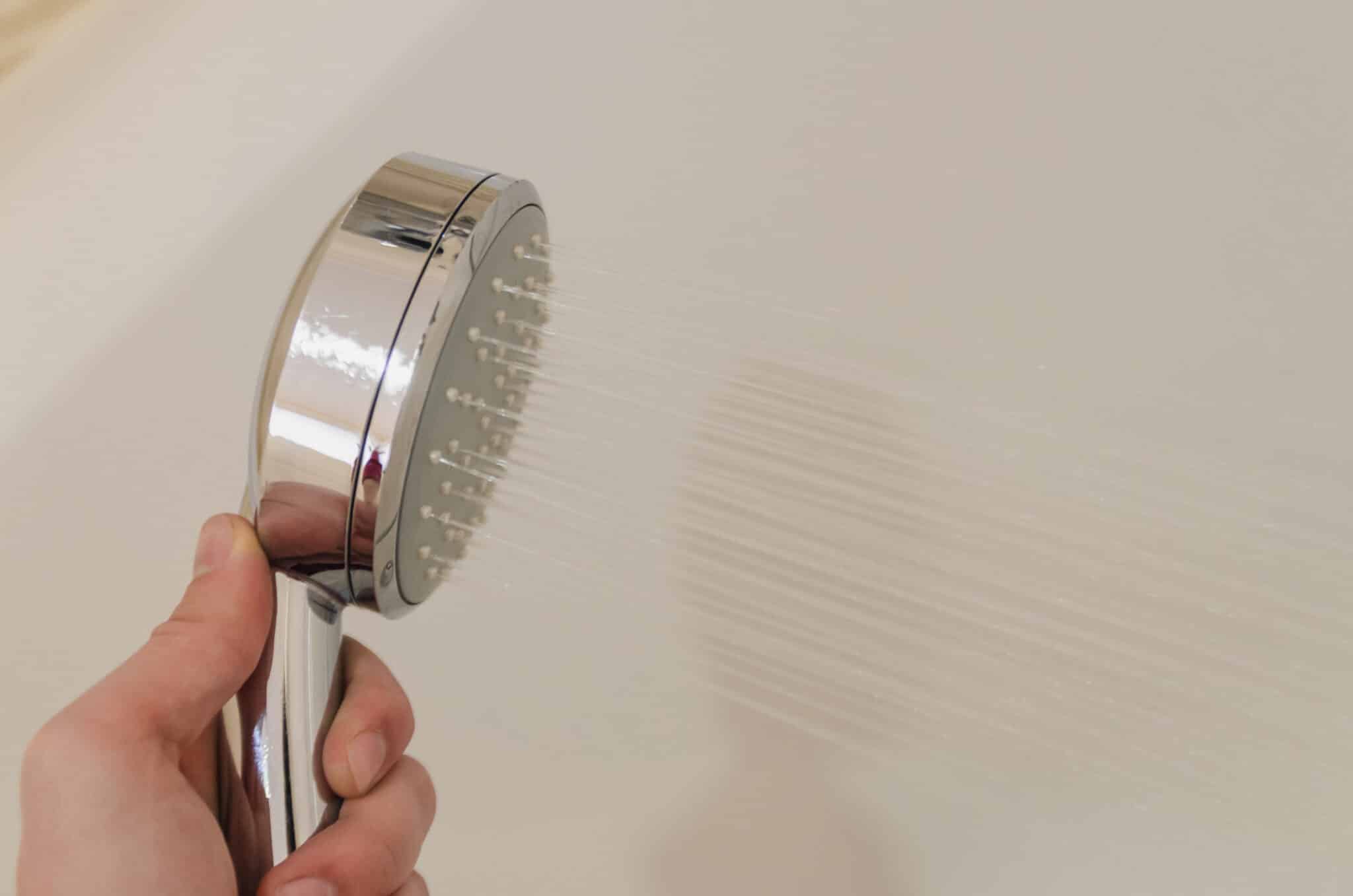 Taking a shower in the bathroom, Benefits, Pressure Regulator.